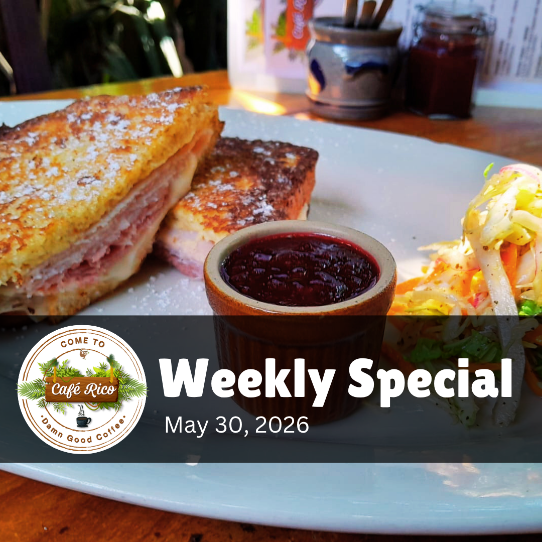 Monte Cristo at Café Rico, known for the best breakfast in Puerto Viejo Costa Rica, with smoked ham, deli ham, Swiss cheese, pickles, and Dijonaisse between French toast served with blackberry jam and Café Rico salad